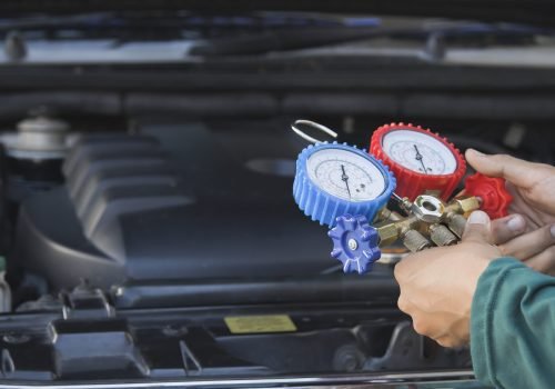 person-is-holding-pressure-gauge-that-is-red-blue